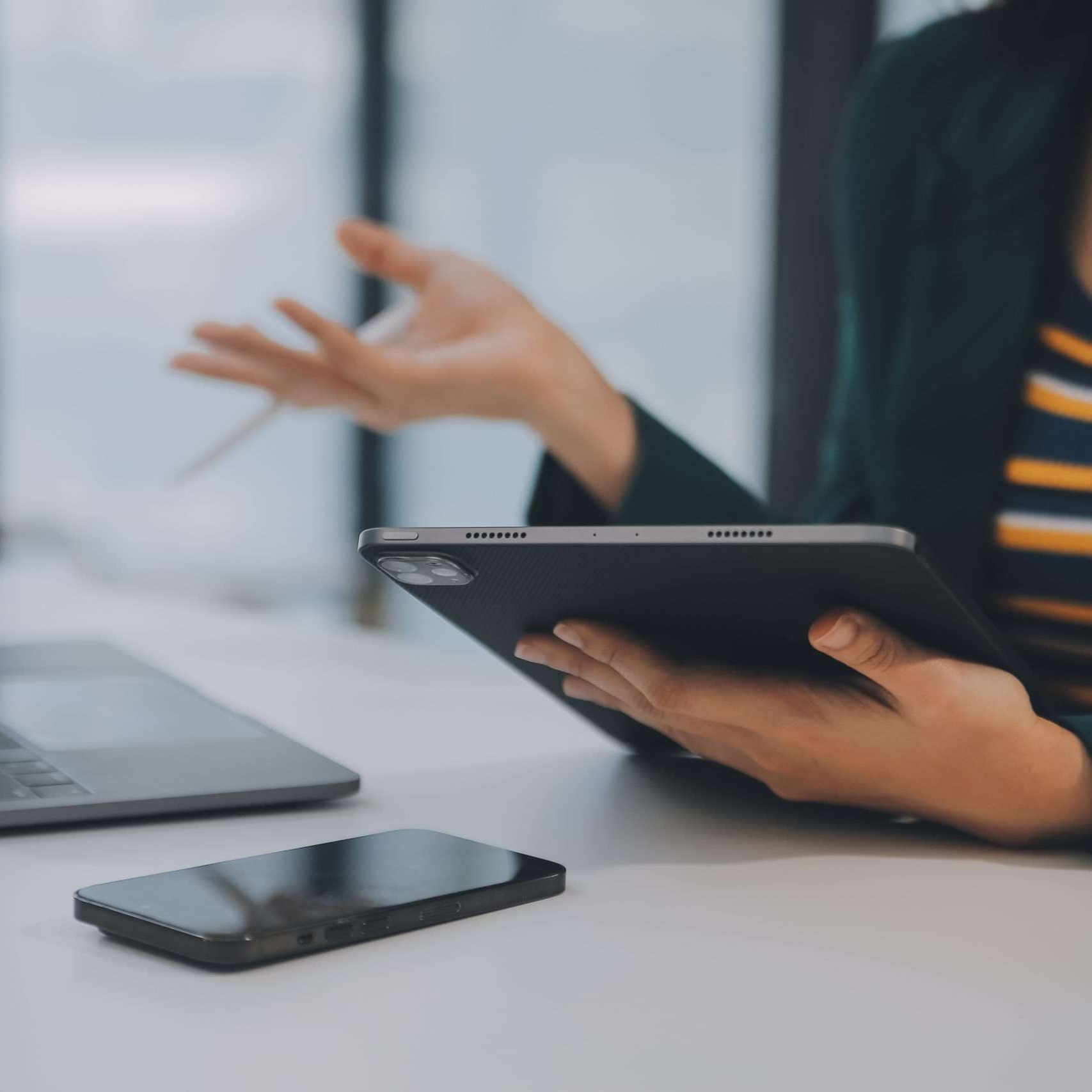 Charming Young asian businesswoman sitting on laptop computer in the office, making report calculating balance Internal Revenue Service checking document.